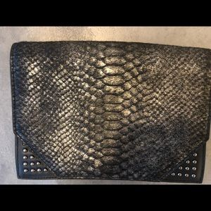 Beautiful purse with faux animal skin design.